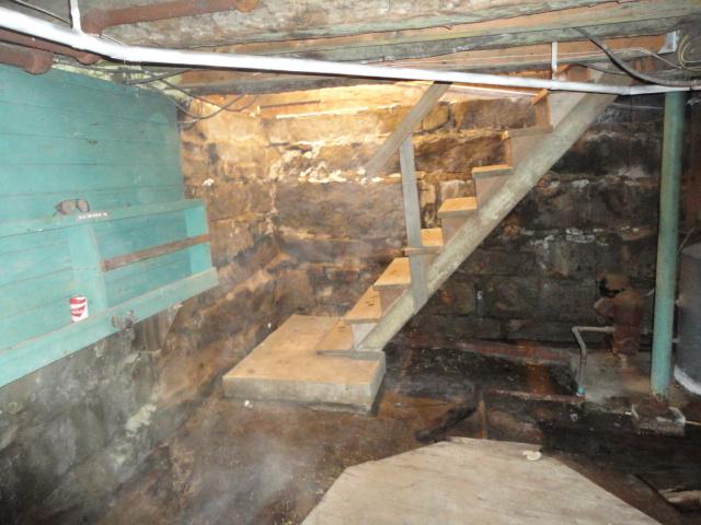 The walls of this Goshen, CT basement were exposed fieldstone. To give the basement a more finished look, we installed our CleanSpace Wall System. It is mechanically fastened to the walls, so it will never peel or chip like paint would. Its bright white color reflects all available lighting in the room, making great use of the lighting and brightening the room. 