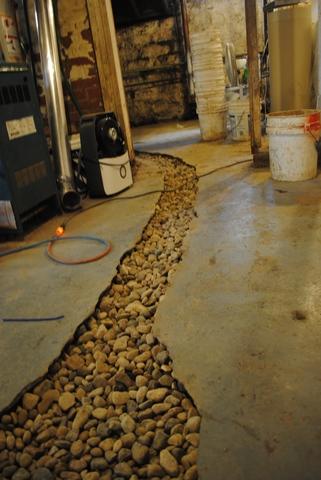 Trench with rocks leading to sump pump