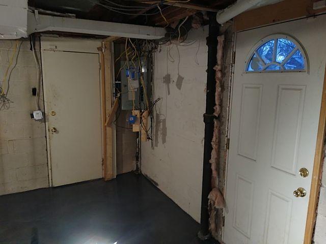 Exposed wires posed a huge safety risk in this basement.