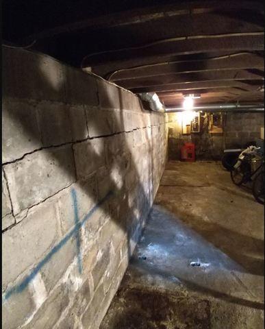 Bowing Wall in Central Square, NY