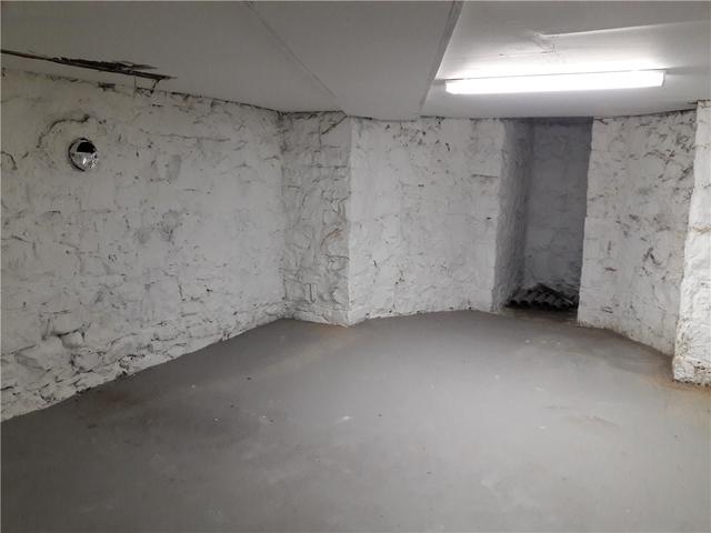 Before CleanSpace, this basement has a musty smell, dampness and the foundation walls were exposed and stained.