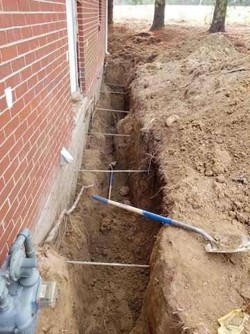 Digging Trench to Install Wall Supports