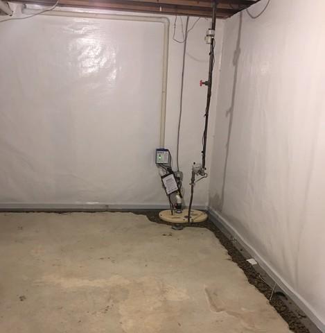 Basement corner view after our production crew installed our CarbonArmor, CleanSpace, and SuperSump Plus M53.