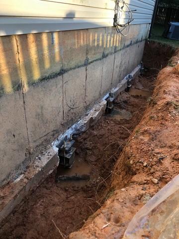 Exposed Foundation on Left Side of Home