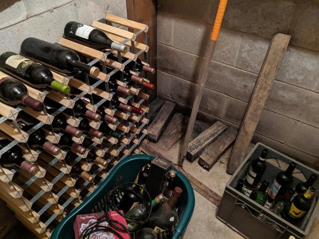 A cozy wine cellar was being moved around constantly to deal with water on the basement floor.