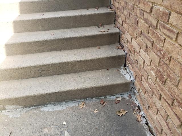 Notice how the stairs are pulling away from the foundation wall. This is a symptom of potential foundation settlement.