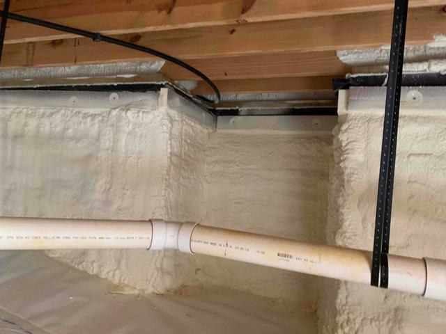 Closed Cell Spray Foam insulation is applied to the crawl space walls. A 2 inch viewing strip is left at the top of the foundation wall, per VA building code, for termite inspection.