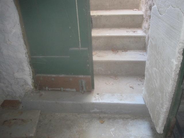 <p>The hatchway stairs leading into this West Simsbury, CT basement were allowing water to enter the basement. To prevent this, our team installed a trench drain at the base of the stairs. This open grated drain is connected to the perimeter drainage system, and any water that comes down the stairs goes into the drain and out of the basement. This system will keep the basement dry for years to come!</p>