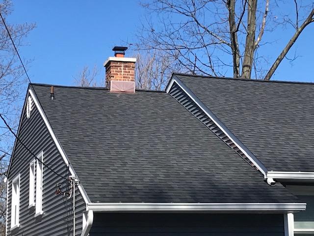 Beautiful new CertainTeed Landmark roof with gorgeous sunburst design on the copper chimney flashing.