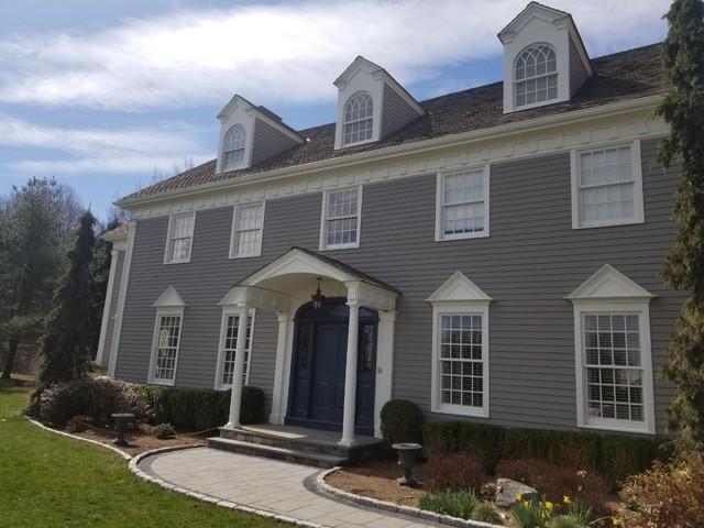 The blue door is perfectly complemented by the new gray paint.