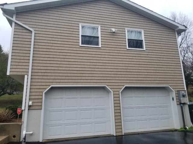 This garage is being power washing before beginning the exterior painting.