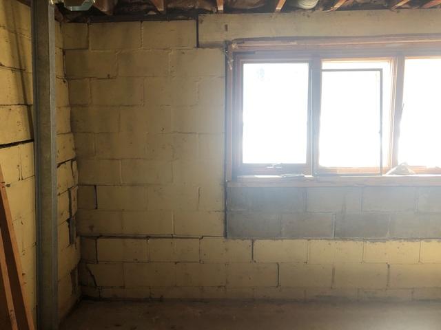Failing walls stabilized with PowerBrace™ Beams