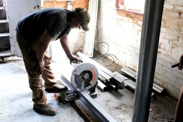 Installer Dillon cutting steel beams for Smart Jack installation