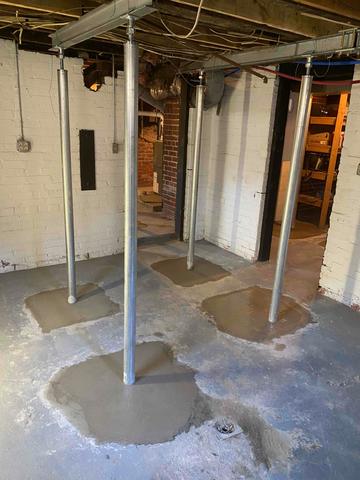 Smart Jacks installed in the basement to lift and stabilize sagging/uneven floors in the home above