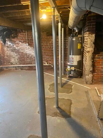 Smart Jacks installed in the basement to lift and stabilize sagging/uneven floors in the home above