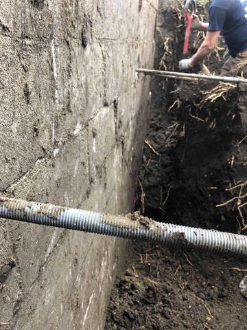 Here, Geo-Lock anchors are being installed. These anchors are drilled through the wall resulting in more holding power in weak soils. These heavy-duty steel earth anchors are embedded in stable soil away from your foundation wall and then connected to steel wall plates with galvanized steel rods.