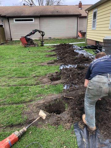 In these holes, a few feet apart is where the wall anchor system will go. The anchors work to prevent further wall bowing from soil pressure. By anchoring them in stable soil, we can also tighten the cable over time, hopefully straightening the walls. These cause a minimal disturbance to your home, lawn, and landscaping.