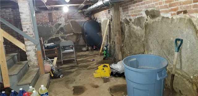 These walls are common in New England, and cracks are common in these walls. Water is able to flood the basement over time or during heavy rain storms.