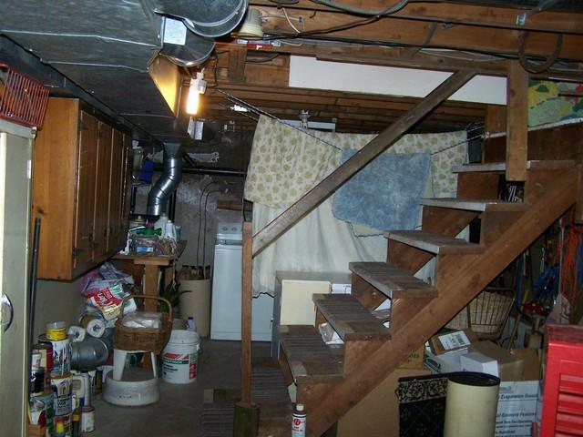 <p>The cluttered basement of this Moodus, CT home had odors permeating the area, a clear sign of a mold problem from high humidity levels. Mold can only grow in a moist environment, not in an area with dry air. To dry out this basement, we installed our SaniDry Basement Air System. This powerful dehumidifier can remove up to 109 liters of water from the air, and it is self emptying so the home owners do not have to worry about remembering to remove a collection tank.</p>