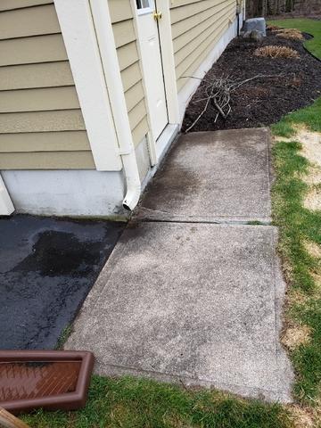 Watch your first step! Can you imagine this homeowner had to hold her breath every time someone stepped out of her garage?