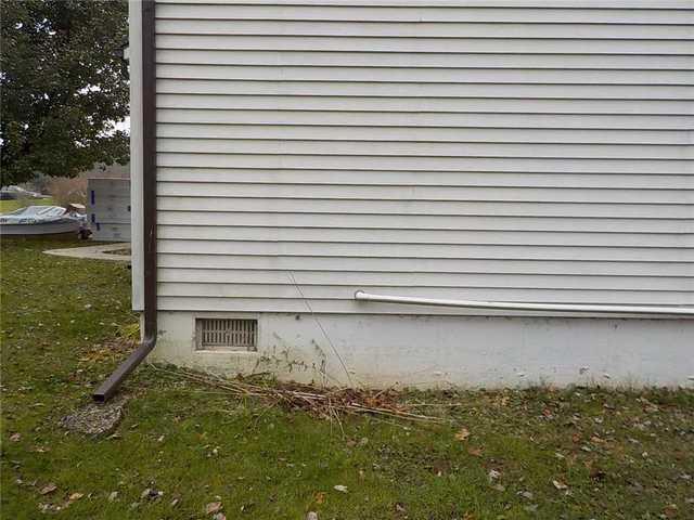 Outside Vent Used to Discharge Water From Crawl Space