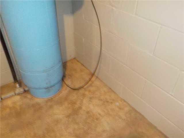 Water Damage to the Floor of Cassie's Basement