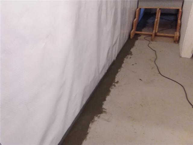 This vapor barrier directs any moisture to the drain system.