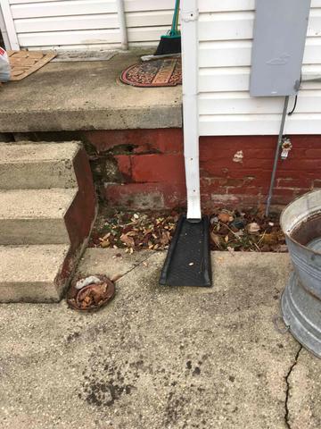 Foundation cracks near front porch steps