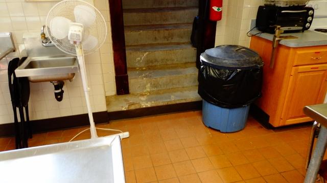 The hatchway stairs leading into this church basement in Somersville, CT were allowing water to enter the area, making it sometimes unusable. To prevent this in the future, we installed our trench drain at the base of the stairs. This open grated drain collects any water that would otherwise enter the basement. It is connected to the perimeter drainage system, and the water is directed out of the basement.