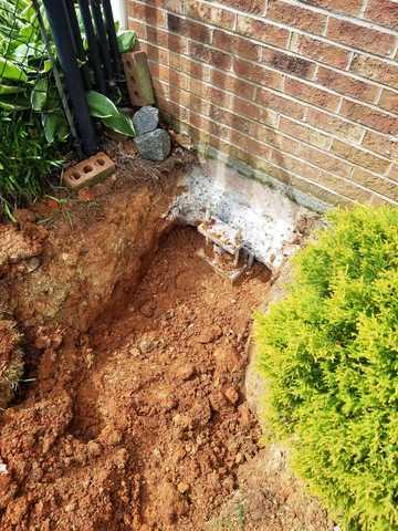 This home had the most trouble of the this corner of the house. The cracking along this wall was the worst but this pier is now releasing the excess pressure put on it.