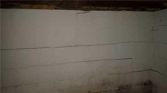 Before Photo Showing Cracked And Bowing Walls