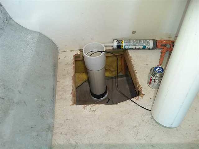 The system's uptake tubing is attached here and run up to the vacuum in the attic.