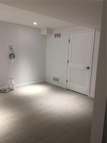 A corner of the room which shows the installation of our Everlast walls, ThermalDry flooring and a door with a new frame. Clearly this basement went from outdated to ahead of its time in an instant!