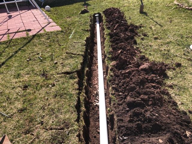 This homeowner wanted an extended exterior discharge line for water to drain.