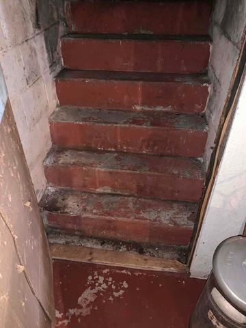 Bottom of exterior basement steps