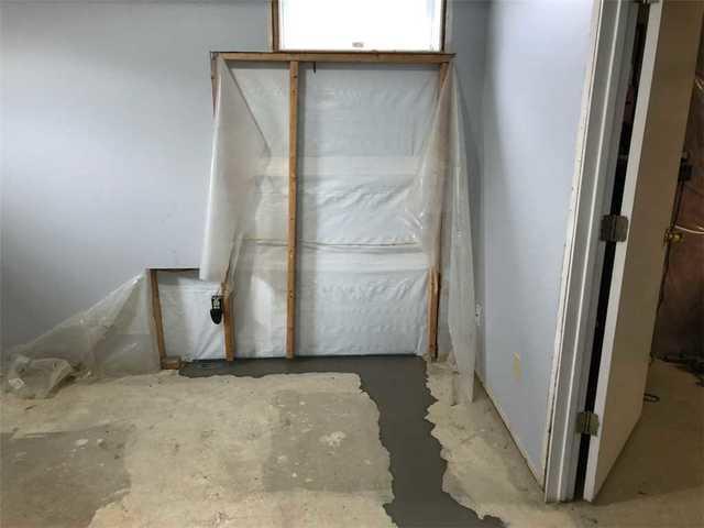 Concrete drying on a freshly installed lateral drain