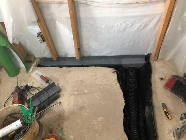 Our lateral drain connecting to a sub-floor waterproofing system