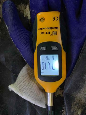 The relative humidity is how much moisture air at its current temperature can hold. In this crawl space, it is 81.42 degrees Fahrenheit and there is a 74.18% relative humidity (RH). At 60% RH the potential for mold growth occurs. The humidity and moisture in the air are absorbed by porous surfaces such as the insulation and wood. Condensation occurs on cooler surfaces such as ductwork, plumbing, and foundation walls.