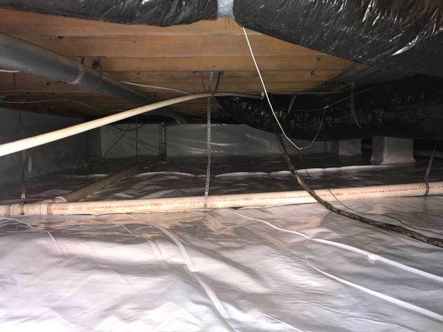 Sealing off a crawl space and treating it like part of the home is the best way to protect it. The first step in this process for this home was a vapor barrier. With the old debris and insulation cleaned out, the new CleanSpace vapor barrier can better protect the crawl space's humidity and stay cleaner longer.