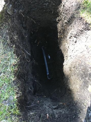 Next, our crew inserted a long, medal rod from the inside foundation wall to each hole outside of the home. Our team tightened and screwed on a GeoLock Wall Anchor to the ends of each rod to straighten the wall to its normal position.