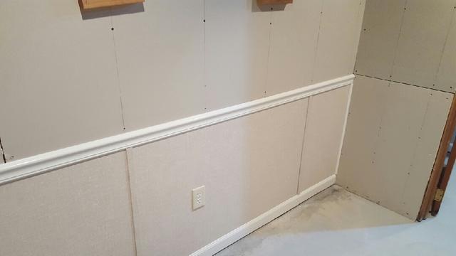 This basement has been finished with new walls, giving it a fresh new look!