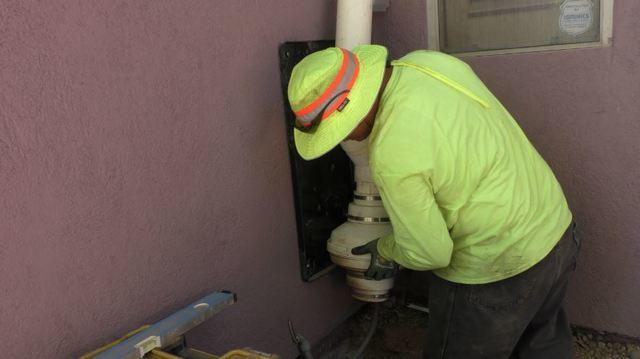 Arizona Foundation Solutions Foreperson, Danny Balderas, preparing to install the MoistureLevel Smart Foundation System on this Tucson Home.