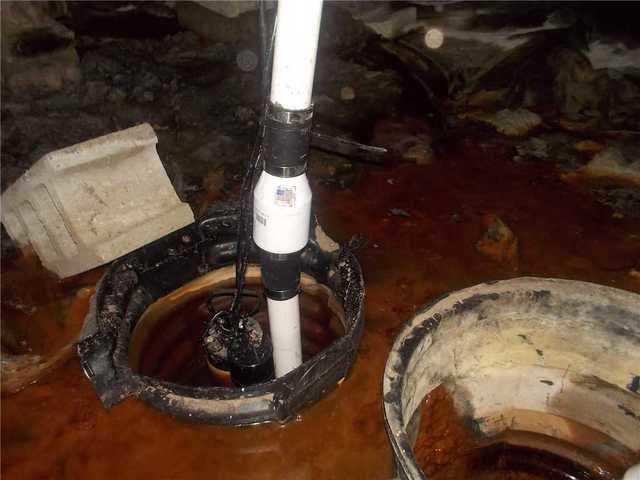 This is an image of one of Barb's old sump pumps and it shows that it is rotted. It stopped working after it could not keep up with the amount of water in her crawl space.