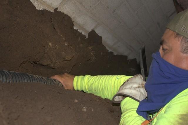 The trench houses drain tile that will direct water to sump pump in the crawl space.