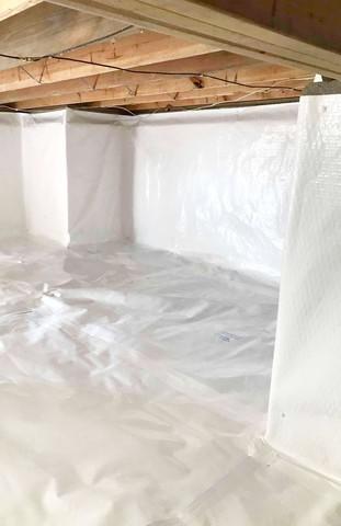 CleanSpace installed to encapsulate the crawl space and prevent moisture from passing through porous walls and floors