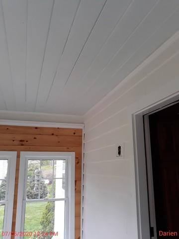 This porch and ceiling look much better with the new paint!