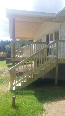 New roof for the front porch tied into the exisiting roof on the home. And new stairs