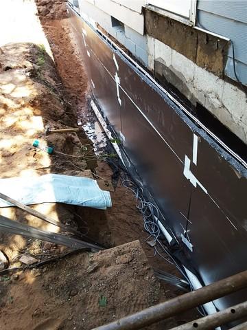 Excavated Exterior Wall Receives Extra Waterproofing Layer