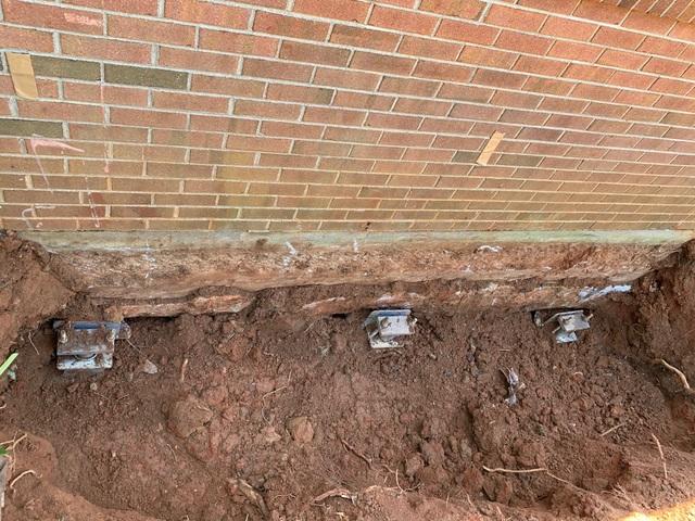 The Helical Piers have been installed and the foundation has been stabilized.