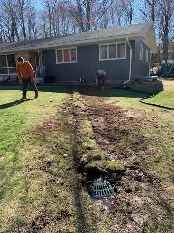 This drainage line was placed far away from the home with a Lawnscape outlet attached for optimal water flow.